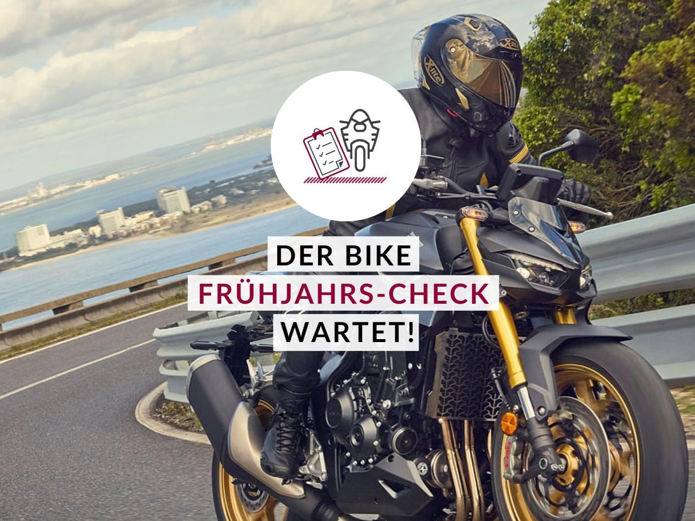 Eine Person auf einem Motorrad im Freien.