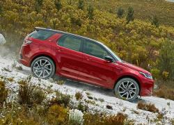 Auto Stahl der neue Discovery Sport 2019 Offroad Bergab Rot Seitenansicht