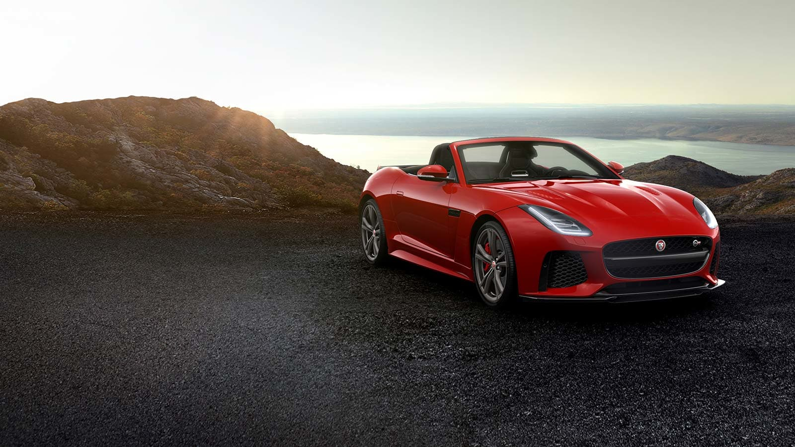 Jaguar F-Type SVR Cabriolet Rot Frontansicht Sonnenuntergang bei Auto Stahl